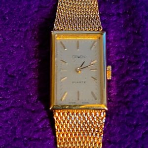 Gruen women's stainless steel gold colored watch